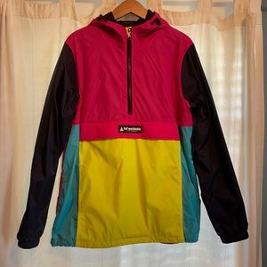 HUF bright anorak jacket with reflective logo on back.